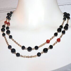 Beautiful vintage gold, glass black and orange beaded necklace 43"
